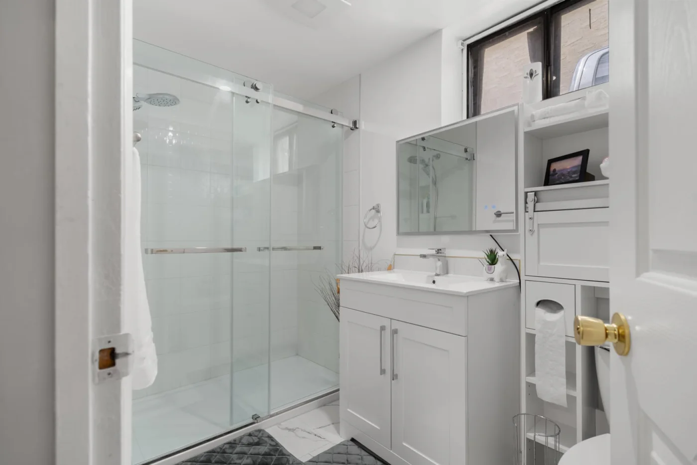 Modern bathroom with glass shower in the Fonda Way suite thumbnail