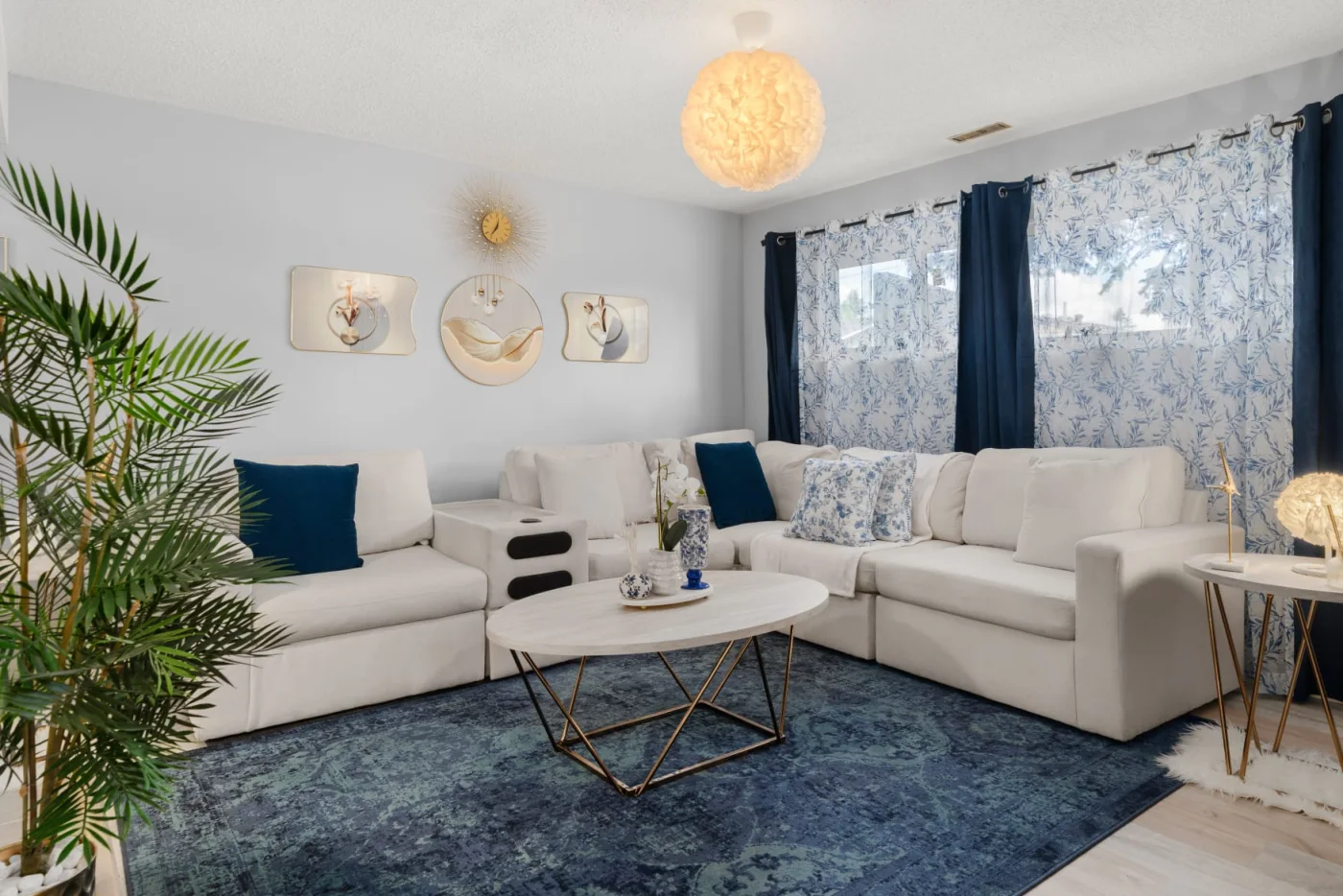 Blue and ivory furnished living room in the Fonda Way suite